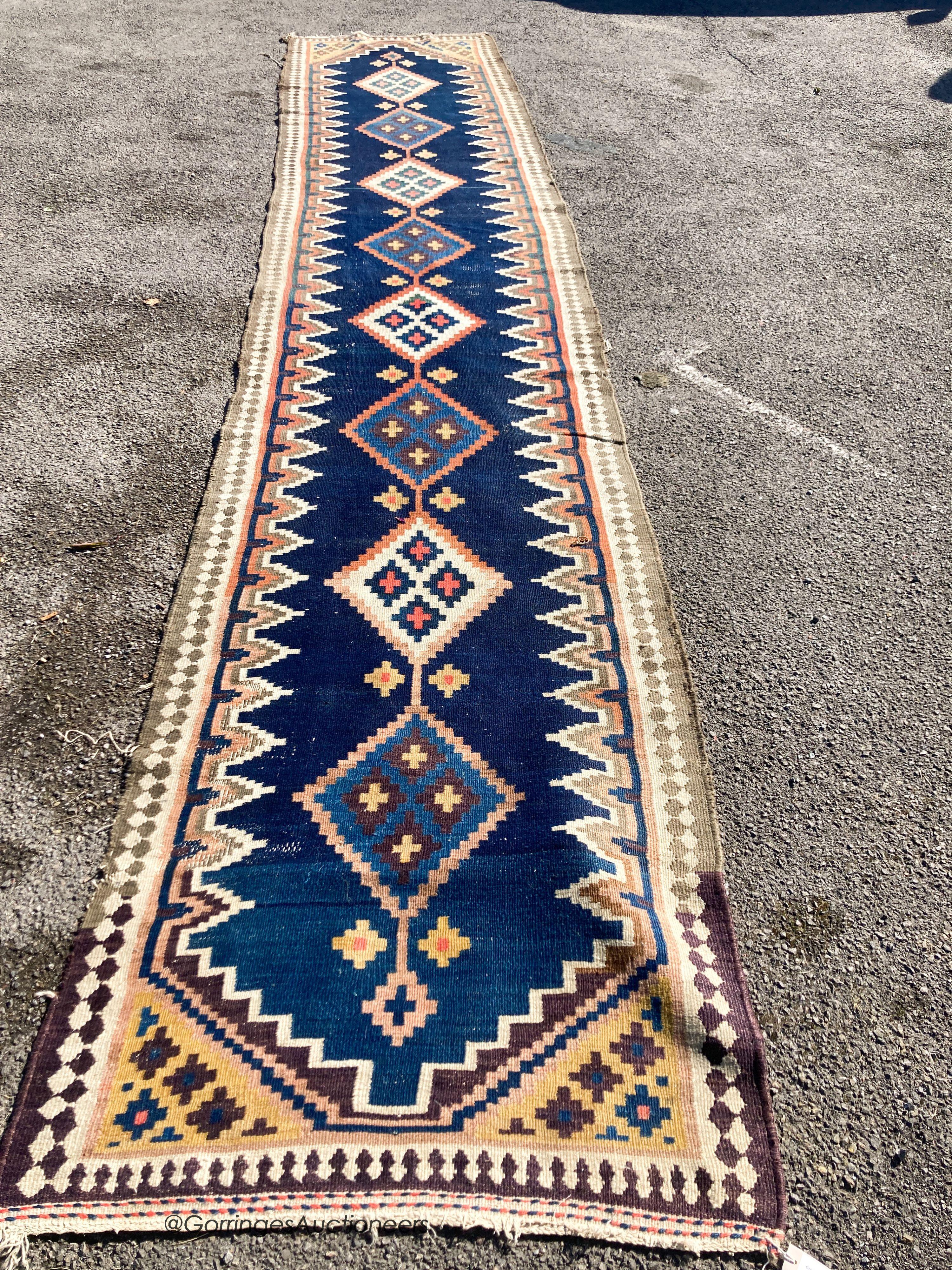 A long Eastern flatweave Kelim runner, 540 x 108cm